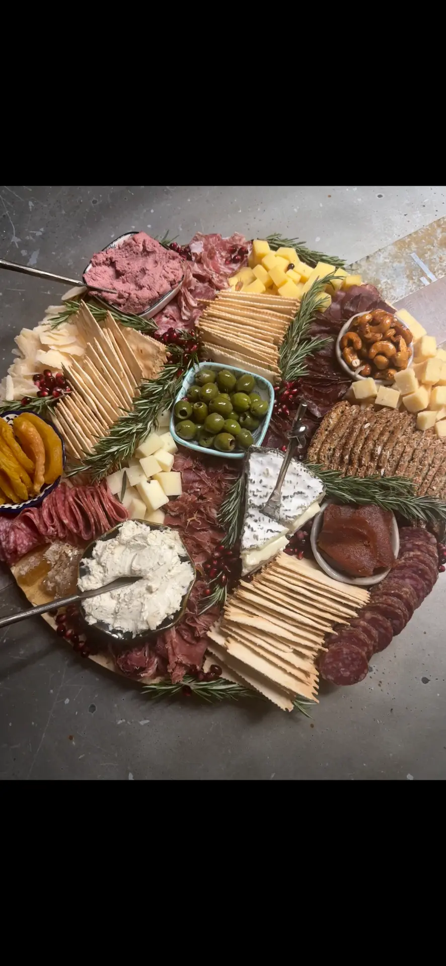 Round luxury charcuterie board with pâté, blue cheese, cured meats and rosemary — charcuterie boards Anchorage by Fireweed & Fig